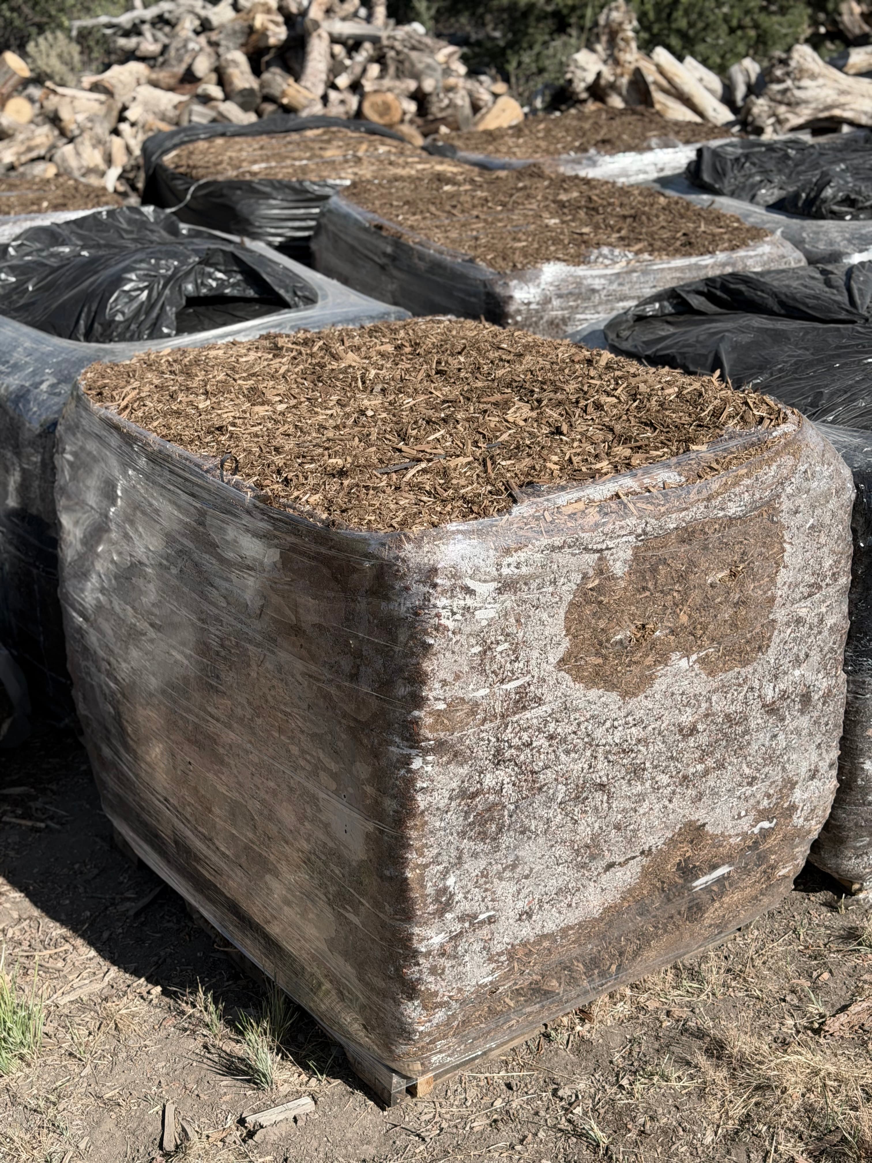 4 cubic yard Western Red Cedar mulch bale on a pallet, sold by LandEx Earthworks in Durango, CO