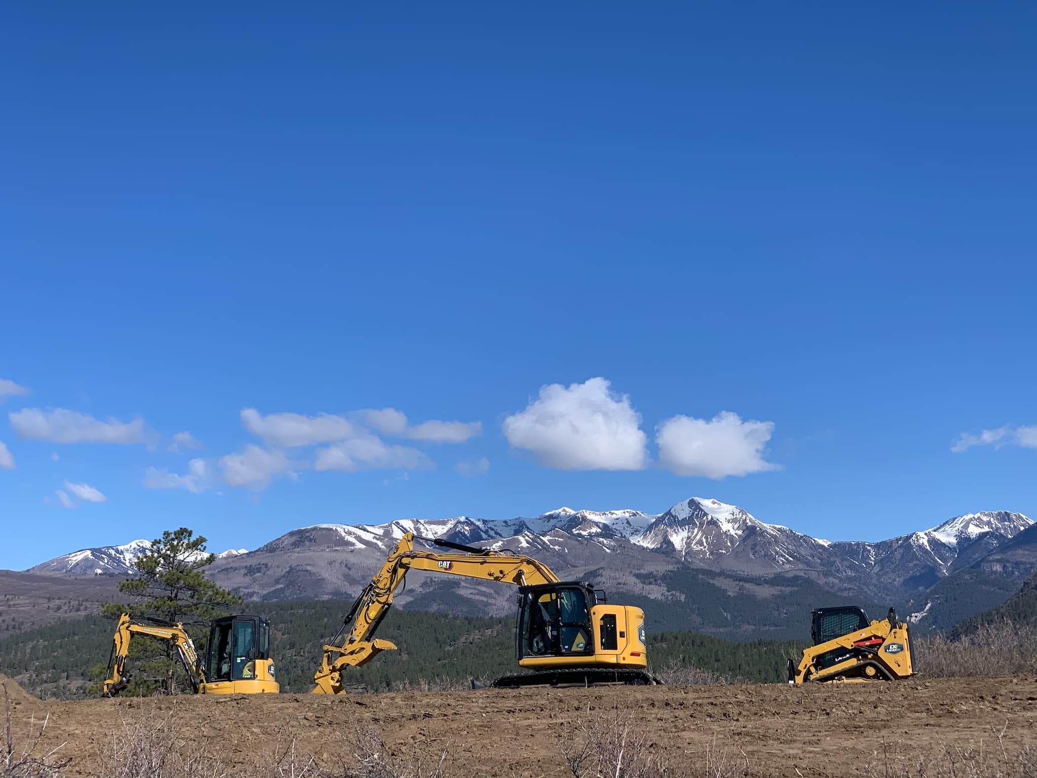 Land clearing and grading services in Durango, Colorado by LandEx Earthworks, excavators on mountain terrain