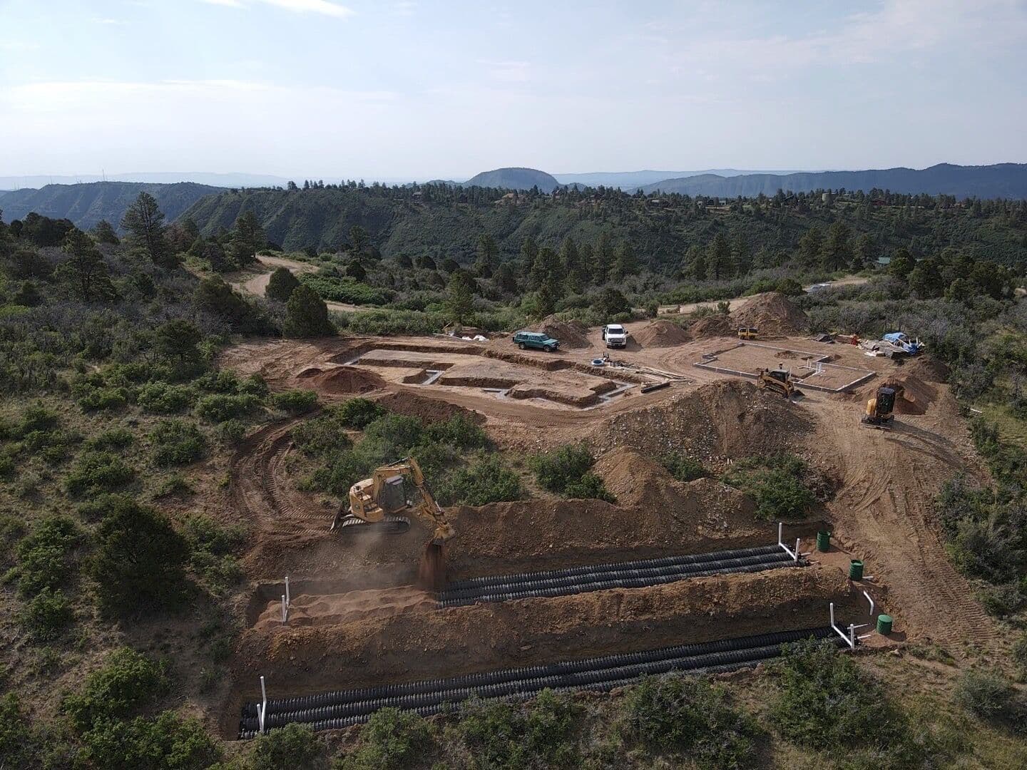 Aerial view of excavation and septic system installation on a mountain property near Durango, Colorado by LandEx Earthworks