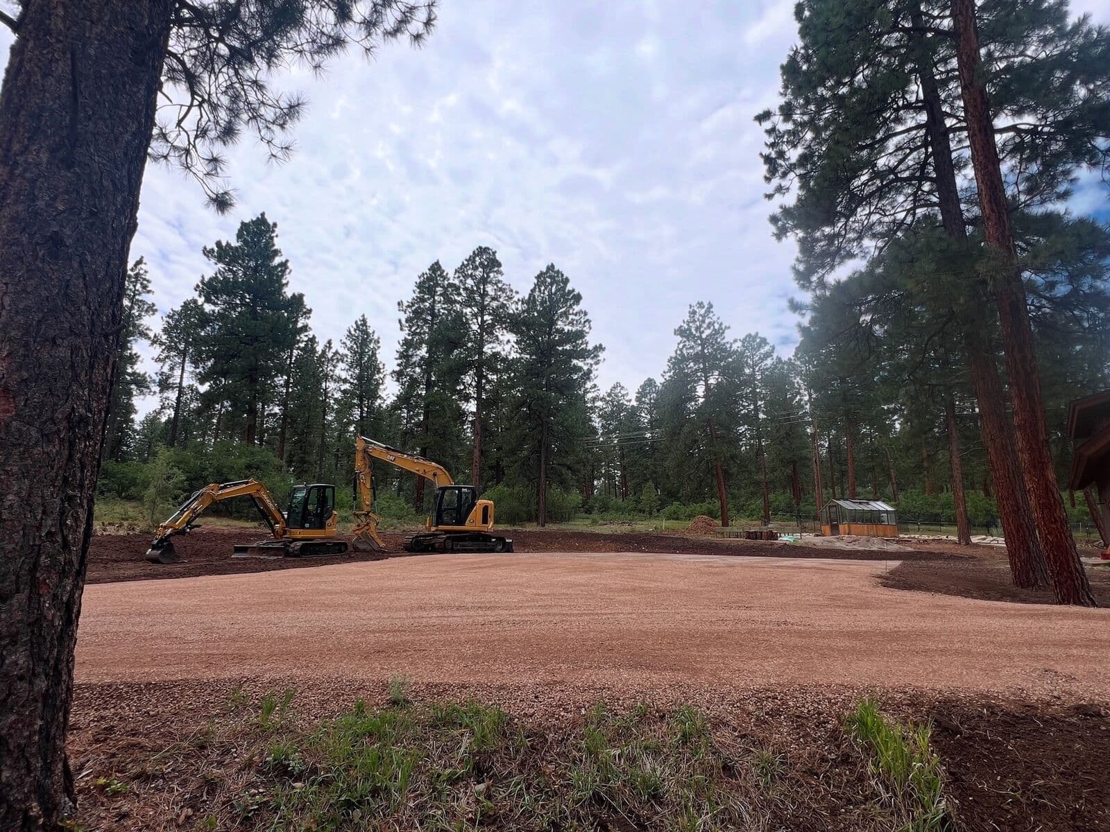 LandEx Earthworks excavators clearing a mountain lot in Durango, Colorado